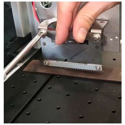 How does the StrikeStopper help prevent printhead strikes?